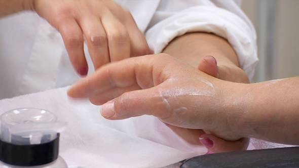 Manicurist Hands Doing Hand Massage With Cream